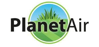 A logo of planet earth with grass in the background.